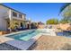 Stunning backyard with a large swimming pool, balcony, and patio seating area at 11933 N 140Th Ln, Surprise, AZ 85379