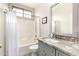 Clean bathroom with a combined shower and bathtub at 12814 W Sells Dr, Litchfield Park, AZ 85340