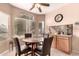 Bright breakfast nook with large windows and a cozy dining set at 12814 W Sells Dr, Litchfield Park, AZ 85340
