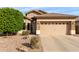 Charming single-story home featuring a well-maintained yard and a two-car garage at 12814 W Sells Dr, Litchfield Park, AZ 85340