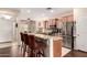 Modern kitchen featuring stainless steel appliances, granite countertops and a breakfast bar at 12814 W Sells Dr, Litchfield Park, AZ 85340