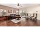 Bright living room with hardwood floors, ceiling fan, and plush seating arrangement at 12814 W Sells Dr, Litchfield Park, AZ 85340