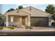 Charming single-story home featuring a two-car garage and low-maintenance desert landscaping at 129 S 176Th Dr, Goodyear, AZ 85338