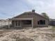 Exterior view of a home with a covered patio and a large backyard at 14930 N Gil Balcome Ct, Surprise, AZ 85379