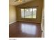 Bedroom featuring wood-look flooring, natural light, and neutral paint at 14930 N Gil Balcome Ct, Surprise, AZ 85379