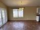 Open dining area features tile flooring, double doors leading to the backyard and ample natural light at 14930 N Gil Balcome Ct, Surprise, AZ 85379