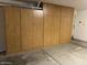 Spacious garage with wall to wall built-in wooden cabinets for storing a lot of items at 14930 N Gil Balcome Ct, Surprise, AZ 85379