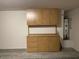 Garage with built-in cabinets for ample storage space, and water heater in the corner at 14930 N Gil Balcome Ct, Surprise, AZ 85379