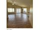 Spacious living room featuring tiled floors, lots of windows for natural light and high ceilings at 14930 N Gil Balcome Ct, Surprise, AZ 85379