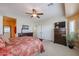 Spacious bedroom with natural light, ceiling fan, carpeted floors, and a cozy atmosphere at 16712 S 175Th Ln, Goodyear, AZ 85338