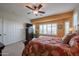 Comfortable bedroom featuring plantation shutters, and closet offering plenty of space at 16712 S 175Th Ln, Goodyear, AZ 85338