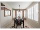 Formal dining room featuring a chandelier and windows with plantation shutters for privacy at 16712 S 175Th Ln, Goodyear, AZ 85338