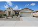 Inviting single-story home with desert landscaping, a two-car garage, and a well-maintained exterior at 16712 S 175Th Ln, Goodyear, AZ 85338