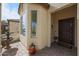 Inviting front porch with a fountain, decorative plants, and a charming entryway at 16712 S 175Th Ln, Goodyear, AZ 85338