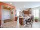 Open kitchen featuring an island with seating, granite countertops, and modern appliances at 16712 S 175Th Ln, Goodyear, AZ 85338