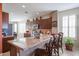 Spacious kitchen with an island, barstool seating, granite counters, and modern lighting at 16712 S 175Th Ln, Goodyear, AZ 85338