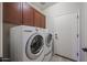 Functional laundry room featuring updated washer and dryer units and convenient storage at 16712 S 175Th Ln, Goodyear, AZ 85338
