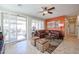 Bright living room with a cozy sectional sofa that leads to a patio area, offering indoor-outdoor living at 16712 S 175Th Ln, Goodyear, AZ 85338