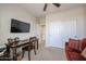 Comfortable office with ceiling fan, large desk and closet for extra storage space at 16712 S 175Th Ln, Goodyear, AZ 85338