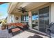 Inviting covered patio with comfortable seating and a ceiling fan, perfect for outdoor relaxation and entertaining at 16712 S 175Th Ln, Goodyear, AZ 85338