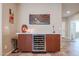 Stylish bar area with a wine cooler and modern design elements at 17662 W Cedarwood Ln, Goodyear, AZ 85338