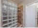 Walk in shower with glass block and tiled walls with built in shelves, and safety handles at 17662 W Cedarwood Ln, Goodyear, AZ 85338