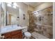 Bathroom featuring a vanity with a sink, a toilet, and a walk-in shower at 17662 W Cedarwood Ln, Goodyear, AZ 85338