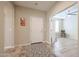 Inviting foyer with a decorative rug and an open doorway to the bedroom at 17662 W Cedarwood Ln, Goodyear, AZ 85338