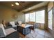 Cozy covered patio with comfortable seating and a fire pit for outdoor relaxation at 17662 W Cedarwood Ln, Goodyear, AZ 85338