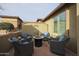 Cozy outdoor patio area with comfortable seating and a fire pit, perfect for entertaining at 17662 W Cedarwood Ln, Goodyear, AZ 85338