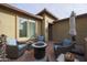 Comfortable patio setting featuring a fire pit, cozy chairs, and ample space at 17662 W Cedarwood Ln, Goodyear, AZ 85338