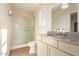 Well-lit bathroom with modern vanity, toilet, and a shower featuring frameless glass doors at 2012 W Lawrence Rd, Phoenix, AZ 85015