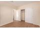 Comfortable bedroom showcases wood floors, closet, and neutral wall tones with bright white trim at 2012 W Lawrence Rd, Phoenix, AZ 85015