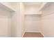 Walk-in closet provides ample storage space with a clean, organized layout and built-in shelving at 2012 W Lawrence Rd, Phoenix, AZ 85015