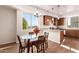 Dining area featuring hardwood floors, modern table, and natural light at 2012 W Lawrence Rd, Phoenix, AZ 85015