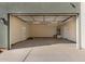Spacious two car garage with neutral paint and attached door to the interior at 2012 W Lawrence Rd, Phoenix, AZ 85015