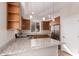 Bright kitchen featuring stainless steel appliances and granite countertops at 2012 W Lawrence Rd, Phoenix, AZ 85015