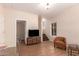 Spacious living area offering hardwood floors, neutral walls, and stairs at 2012 W Lawrence Rd, Phoenix, AZ 85015