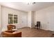 Neutral living room featuring hard surface floors, modern furniture, and natural light at 2012 W Lawrence Rd, Phoenix, AZ 85015