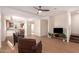 Open-concept living room with hardwood floors seamlessly connects kitchen and dining area at 2012 W Lawrence Rd, Phoenix, AZ 85015