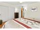 Bedroom with hardwood floors, closet, dresser, and neutral paint at 20215 N Medallion Ct, Sun City West, AZ 85375
