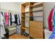 Walk-in closet with built-in shelving, drawers, and hanging rods for organized storage at 20215 N Medallion Ct, Sun City West, AZ 85375