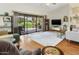 Comfortable living room showcasing wood floors, lots of natural light, and a sliding door to the backyard at 20215 N Medallion Ct, Sun City West, AZ 85375