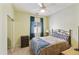 Inviting bedroom with a full closet, a window with soft lighting, and neutral walls at 41201 N Stenson Dr, San Tan Valley, AZ 85140
