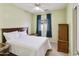 Comfortable bedroom with a large window, carpeted floors, and ample space for a restful retreat at 41201 N Stenson Dr, San Tan Valley, AZ 85140