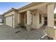 Front porch featuring stone columns and covered entry for a touch of elegance and curb appeal, and a two-car garage at 41201 N Stenson Dr, San Tan Valley, AZ 85140