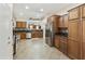 Spacious kitchen with granite countertops, stainless steel appliances, and custom wood cabinets for style and function at 41201 N Stenson Dr, San Tan Valley, AZ 85140