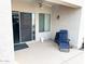 Covered patio with outdoor seating area, featuring a ceiling fan and access to the home's interior at 41201 N Stenson Dr, San Tan Valley, AZ 85140