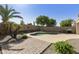 Backyard pool oasis with lush landscaping, a patio area, and a built-in grill for outdoor entertaining and Gathering fun at 41201 N Stenson Dr, San Tan Valley, AZ 85140