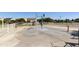 Interactive splash pad with colorful buckets and spray features for water play and recreation at 41201 N Stenson Dr, San Tan Valley, AZ 85140